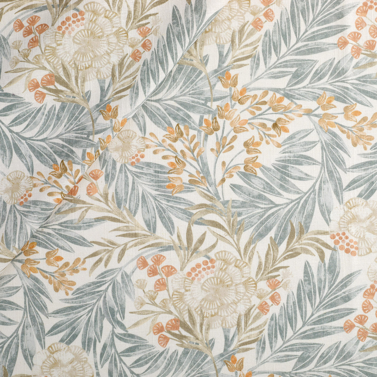 Tonic Living Fable Fabric in Meadow, a multicolour botanical drapery fabric with leafy blue, terracotta, and light brown motifs on soft white.