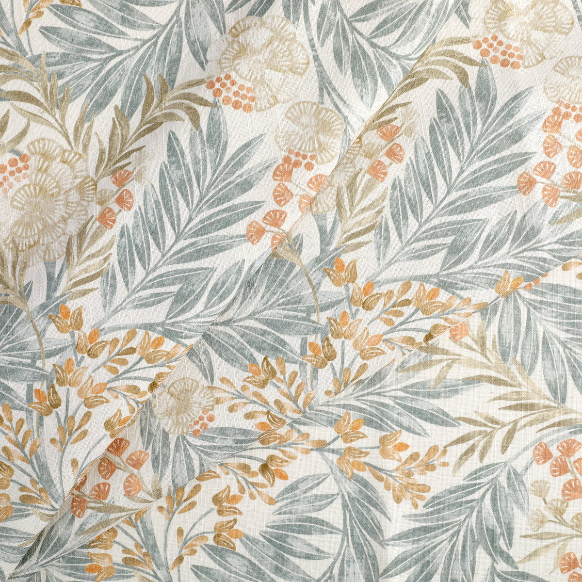 Tonic Living Fable Fabric in Meadow, a soft white botanical drapery fabric with colourful leafy motifs in blue, terracotta, and brown.