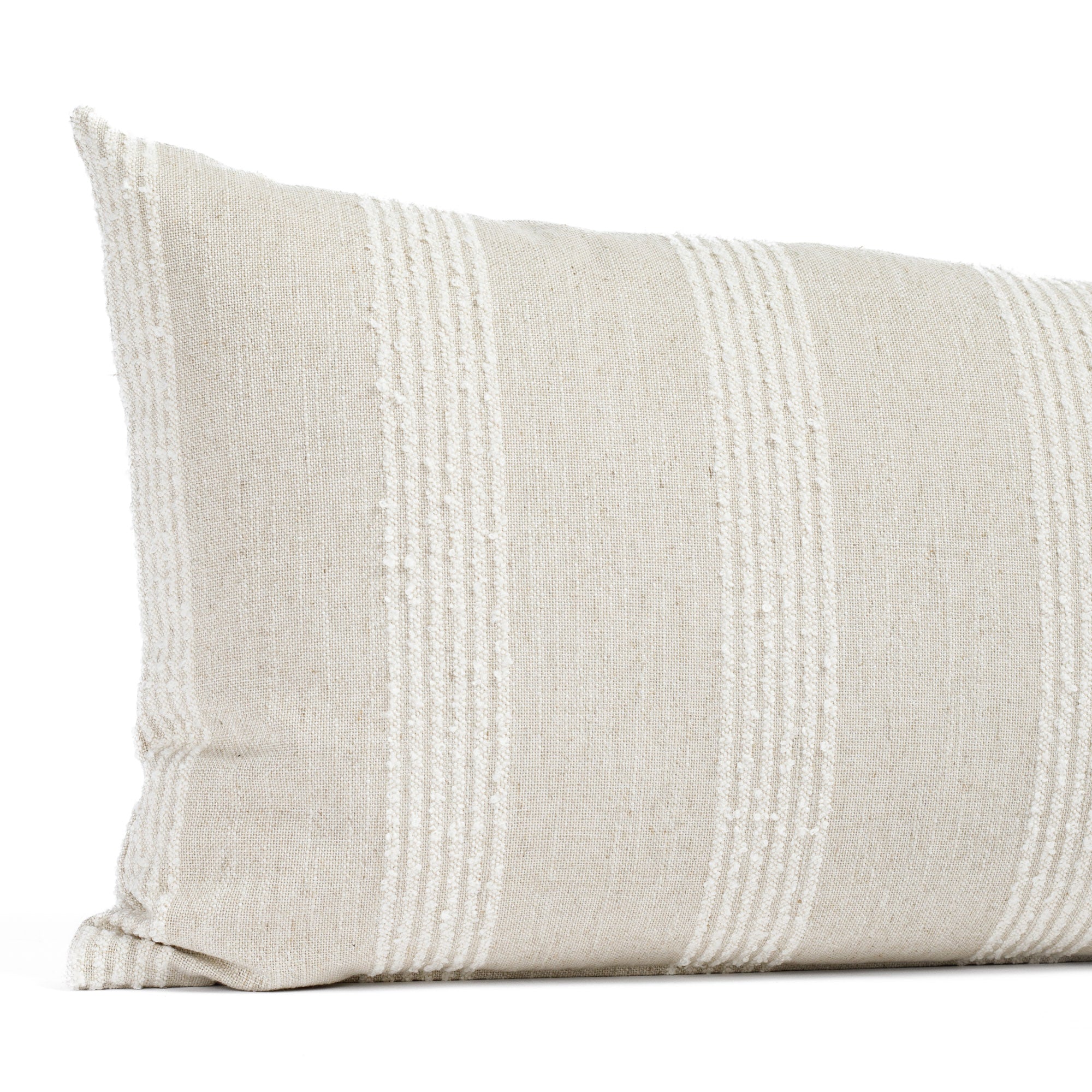 an off white and oatmeal loopy striped lumbar pillow : close up view