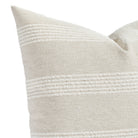 an off white and oatmeal striped pillow : close up view