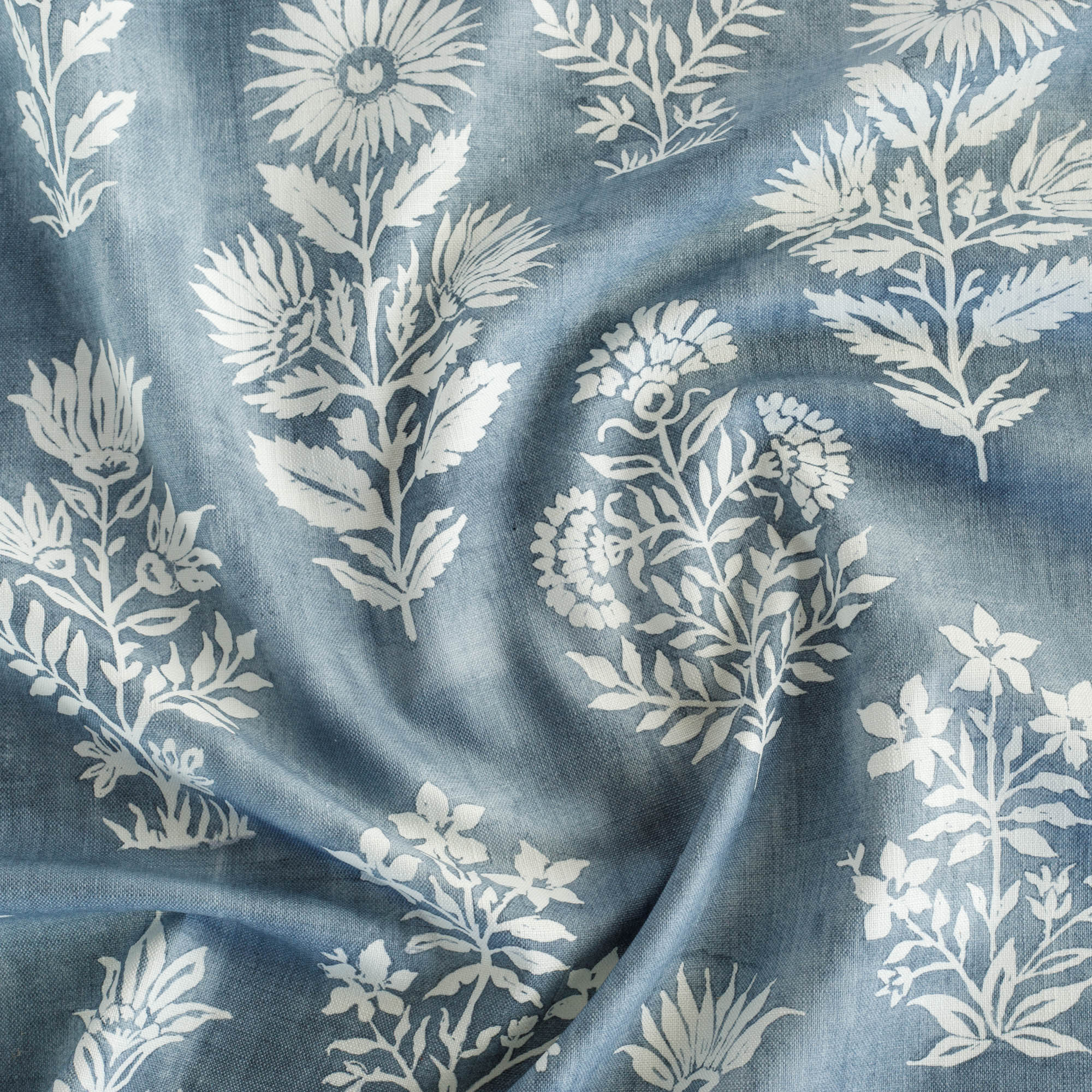 Flora Denim Blue Fabric, a blue and white batik inspired large scaled floral print from Tonic Living
