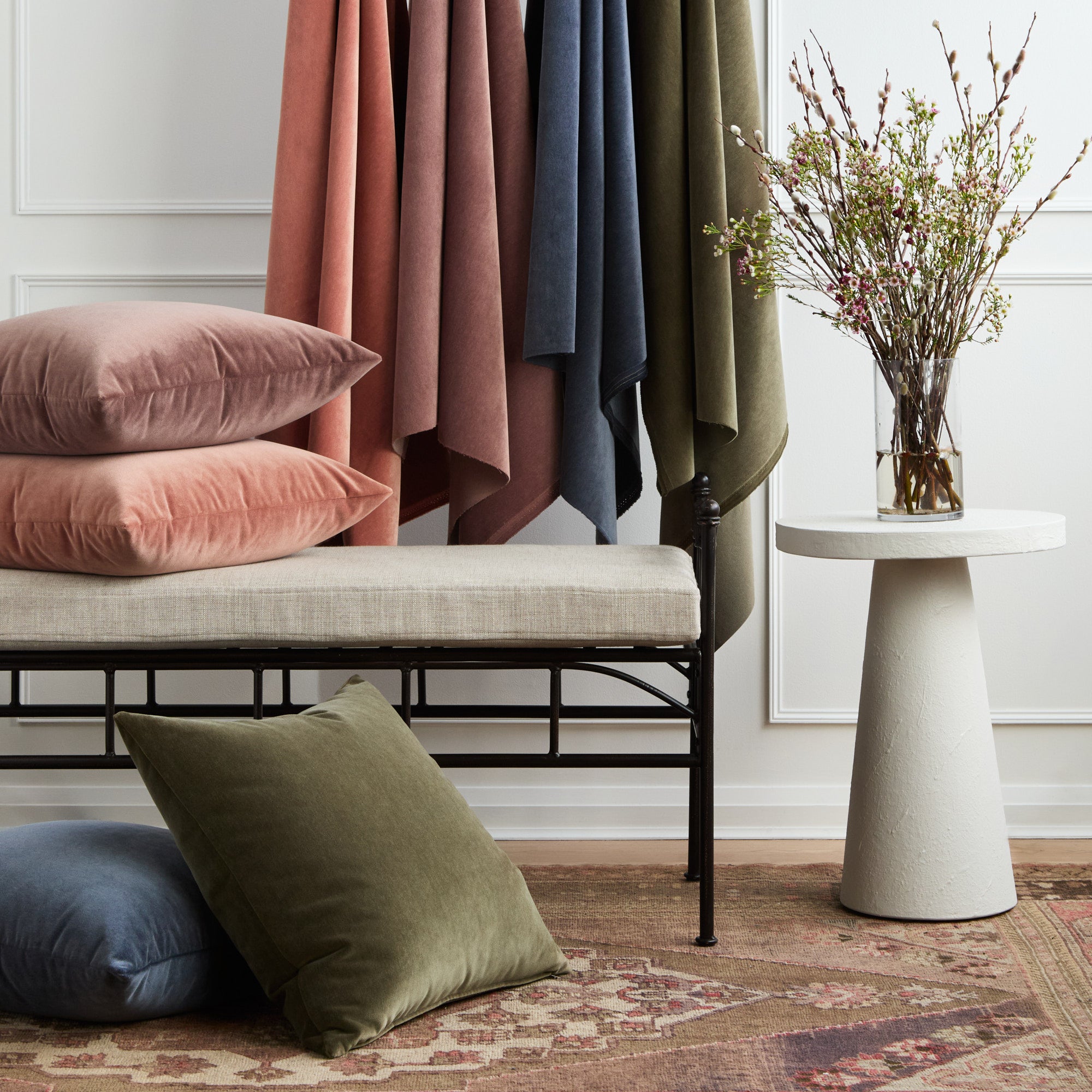 Tonic Living Florence Velvet pillow and fabric collection in pink, green, blue, and dusty purple tones.