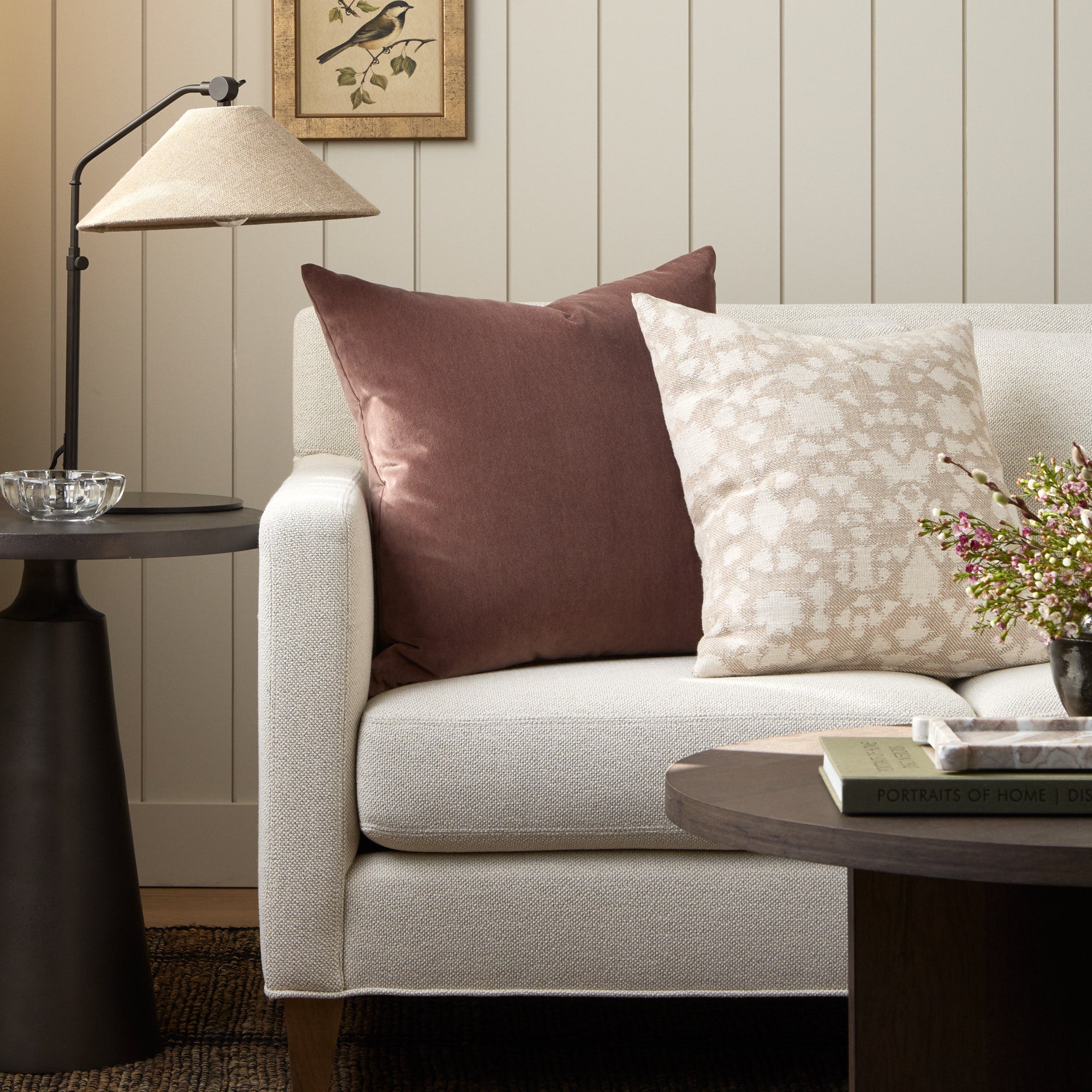Tonic Living Florence Velvet mauve throw pillow styled on a sofa with the Astrid Natural 20x20 cushion.