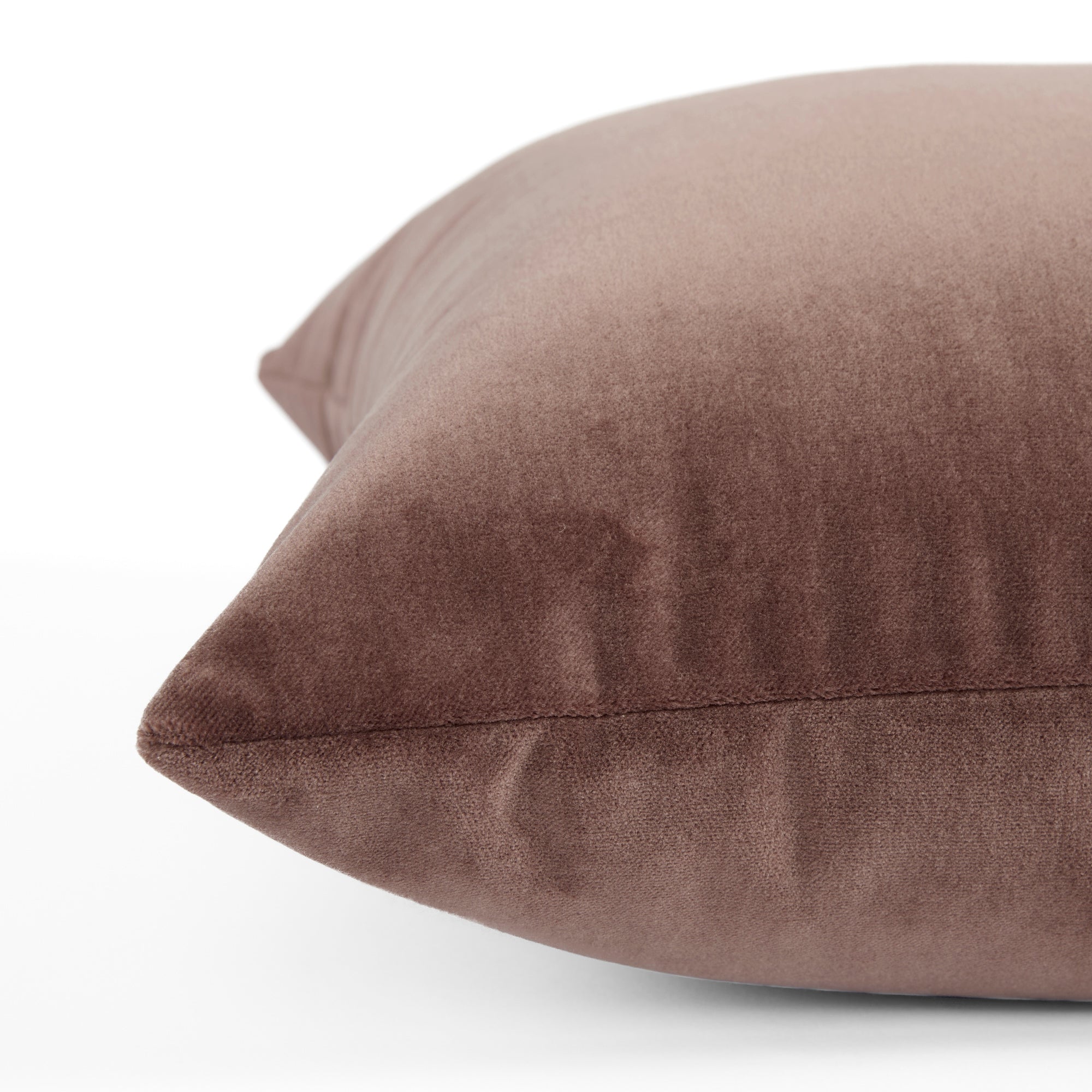 Side view of Tonic Living Florence Velvet decorative pillow in a muted mauve velvet finish.