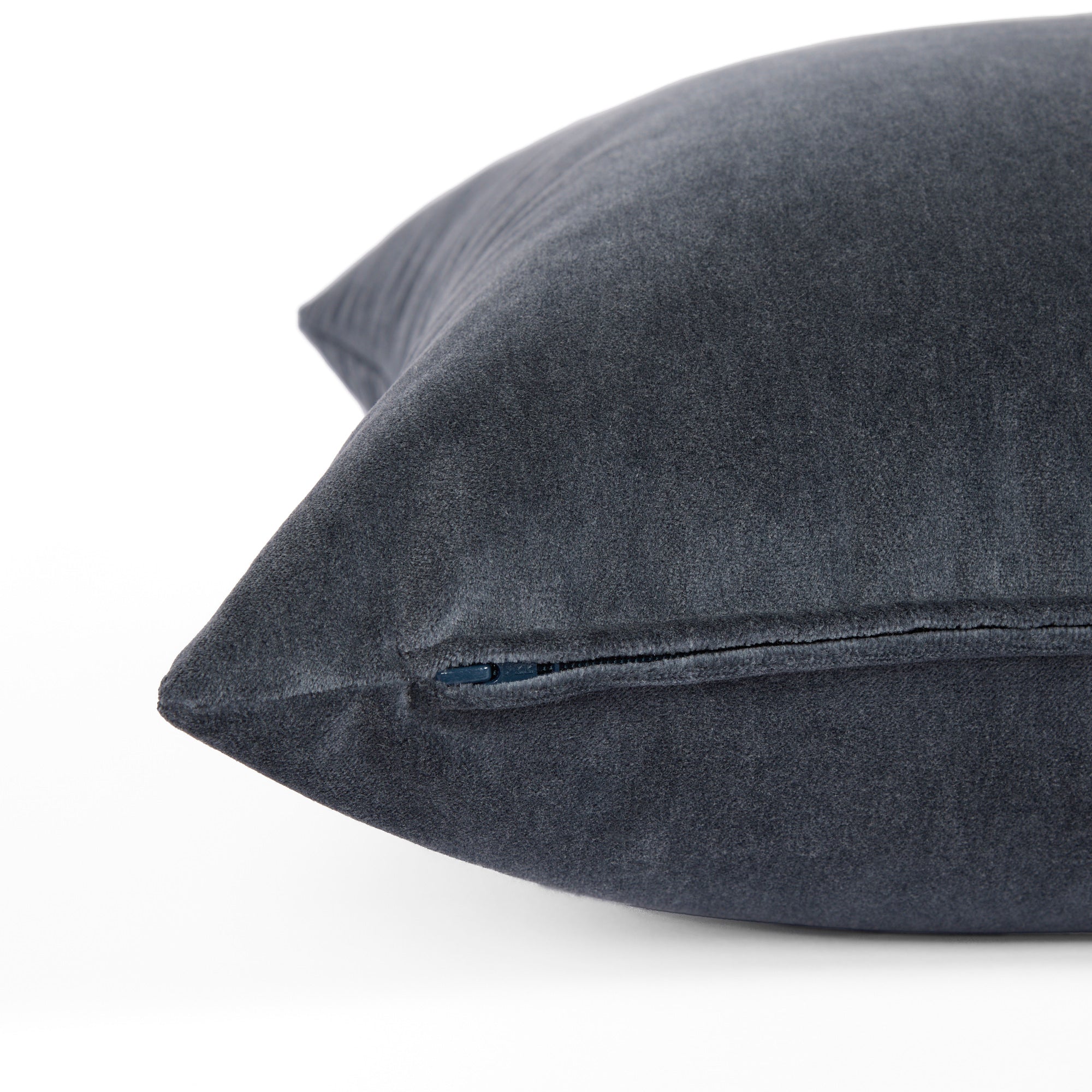 Side zipper detail of Tonic Living Florence Velvet 22x22 pillow in Mineral Blue.
