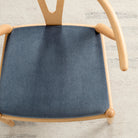 Tonic Living Florence Velvet Mineral Blue upholstery fabric shown on a dining chair seat.