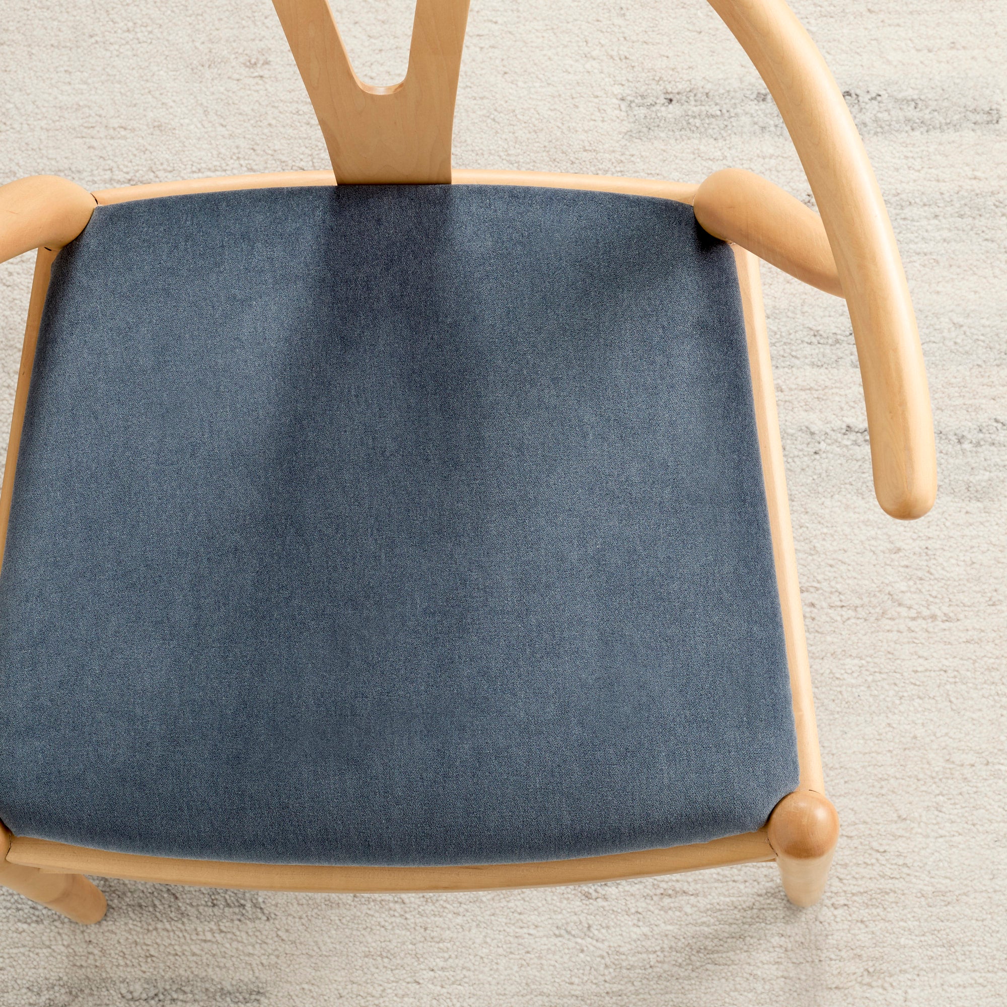 Tonic Living Florence Velvet Mineral Blue upholstery fabric shown on a dining chair seat.