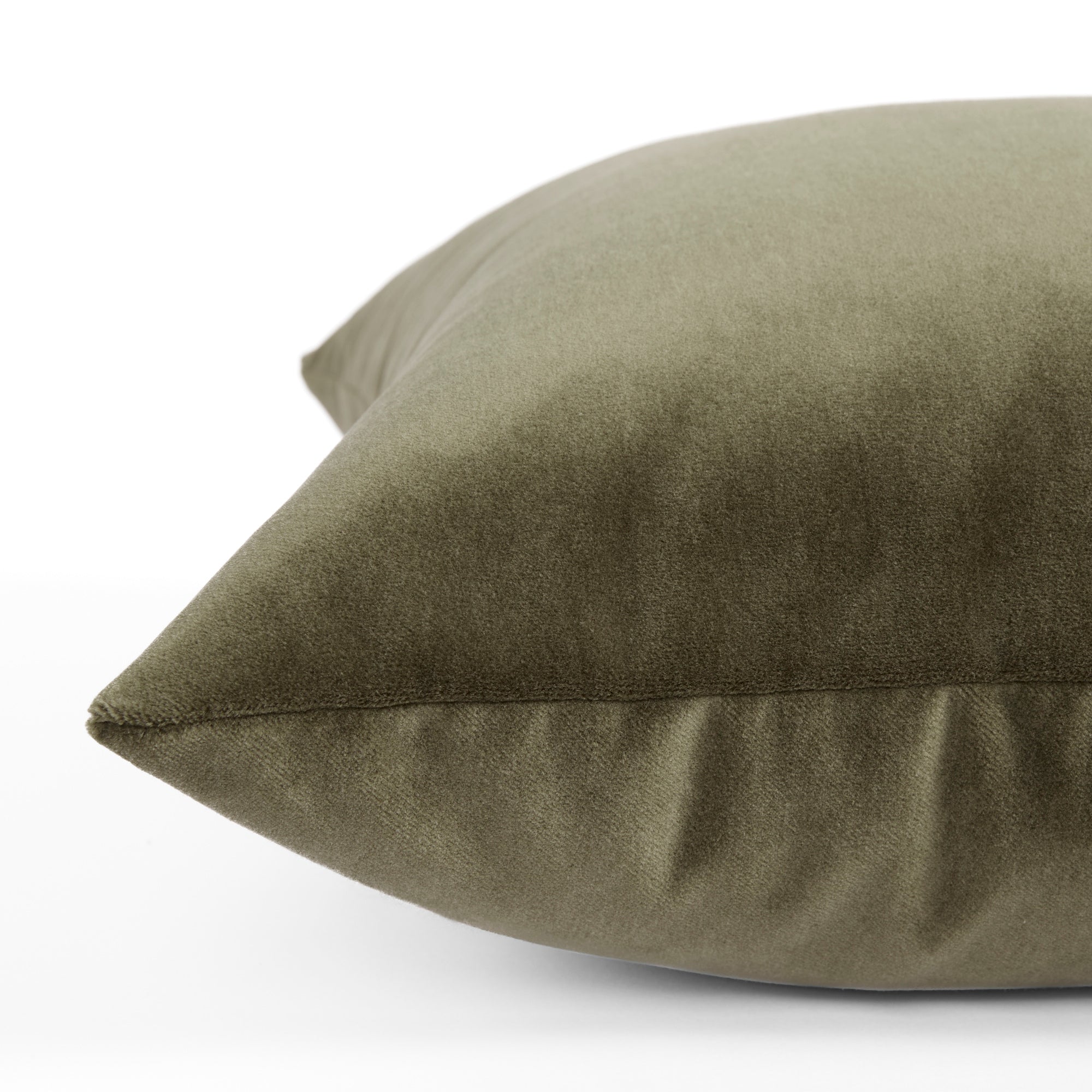 Side view of Tonic Living Florence Velvet decorative cushion in a rich green velvet finish.