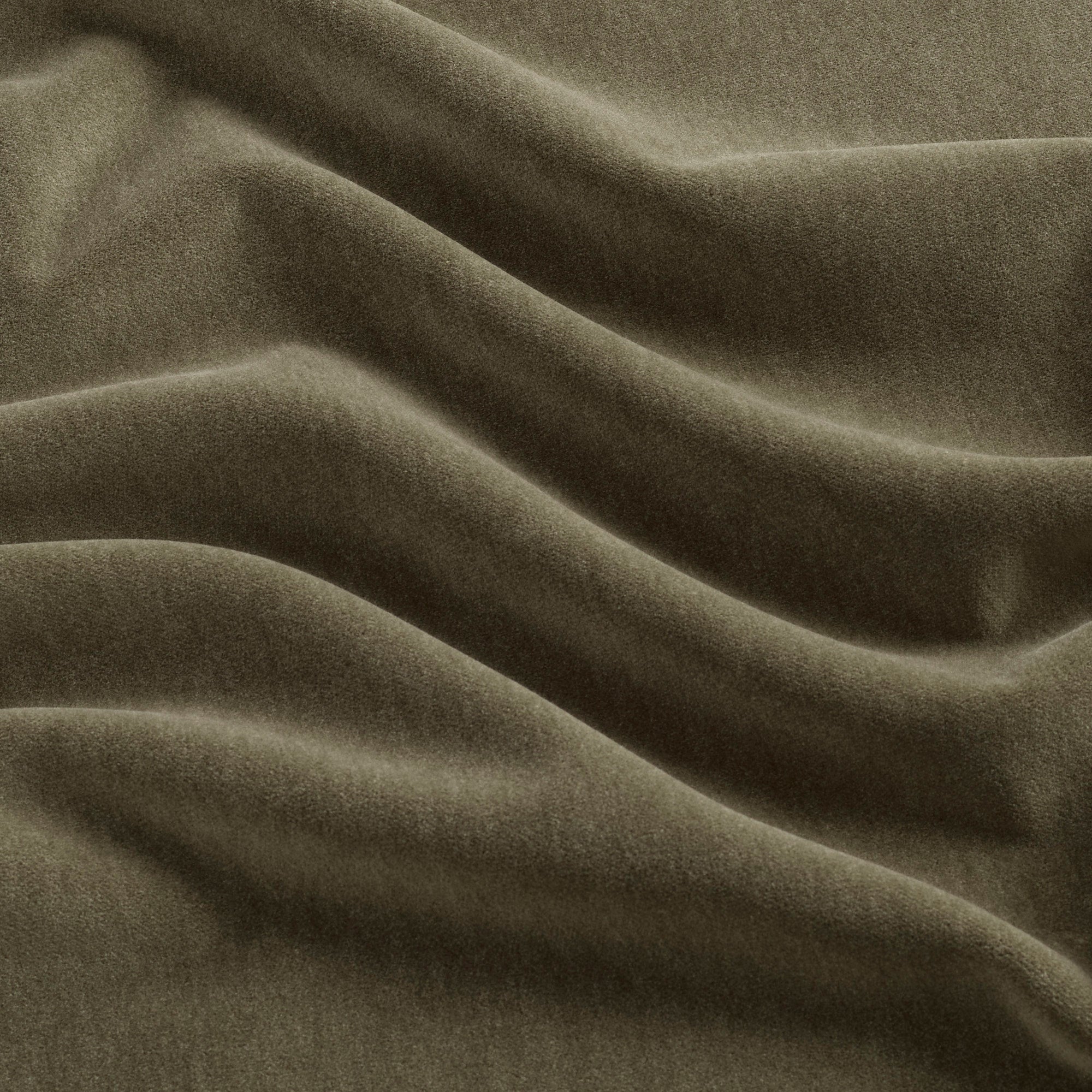 Tonic Living Florence Velvet fabric in Olive featuring a deep, solid green velvet finish.