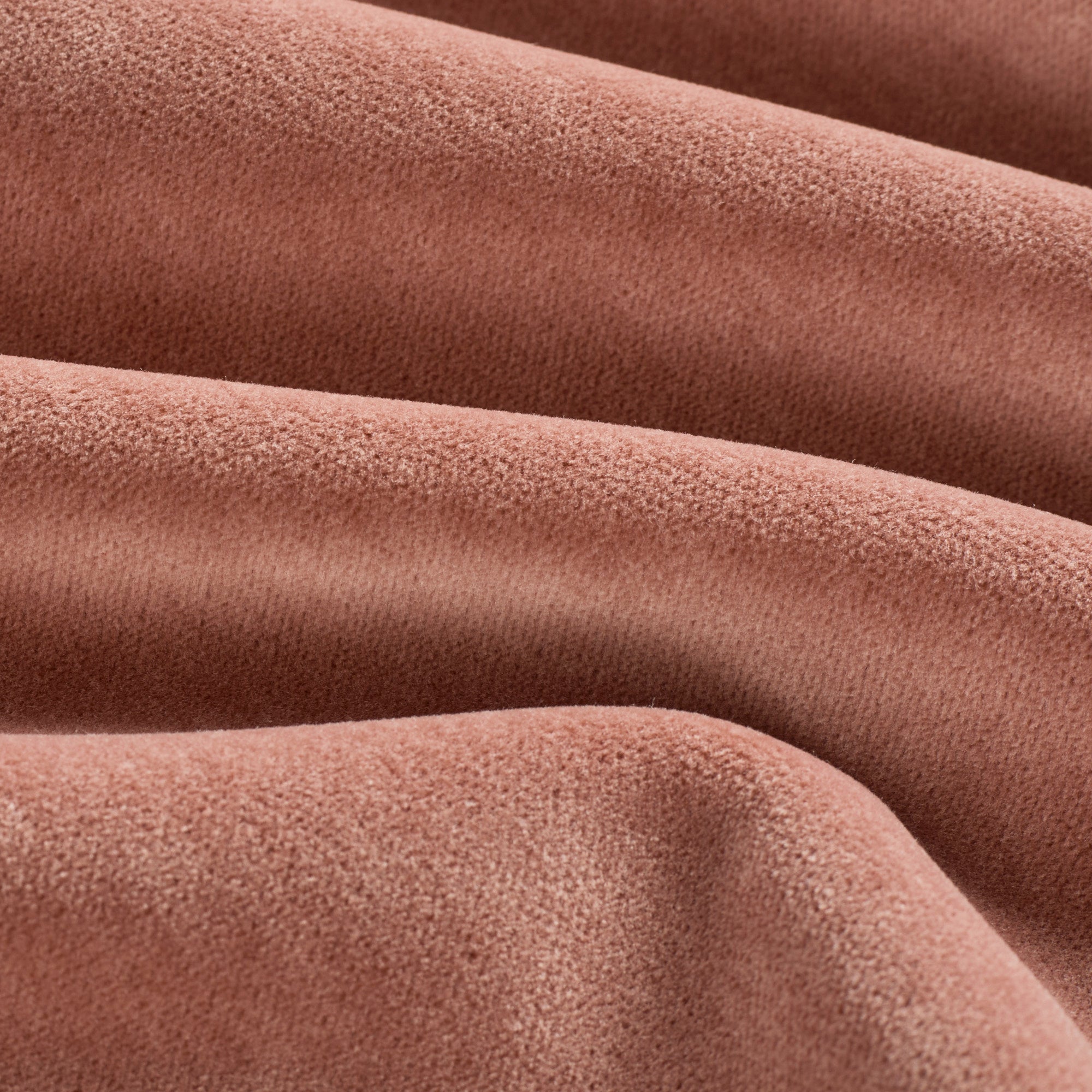 Close up of Tonic Living Florence Velvet Rosewood upholstery fabric showing its plush dusty rose texture.
