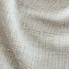 a cool sky blue tweedy textured outdoor fabric : close up view