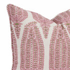 Close-up of a 20x20 pink, green and beige pillow with a paisley-style pattern and piping detail (Georgia Orchid Pink by Tonic Living).