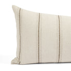 Close up of Tonic Living Gibson Stripe Birch bolster pillow showing neutral beige and brown stripes with fine woven details.