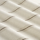 Tonic Living Gibson Stripe Fabric in Birch, a neutral high-performance striped fabric inspired by vintage European grain sack textiles.