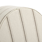 Bottom view of Tonic Living Gibson Stripe Birch round ottoman showing the concealed zipper and striped upholstery.