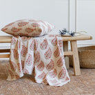 Stacked Tonic Living pillows: Grace 20x20 Throw Pillow, Rosewood with Bedford 22x22 Pillow, Merlot.