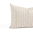 Close up of Tonic Living Hadley Stripe Mist pillow showing a blue and warm brown bamboo-inspired stripe on off-white.