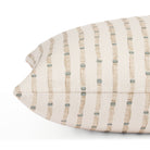 Side view of Tonic Living Hadley Stripe Mist lumbar cushion highlighting its blue and brown organic striped pattern.
