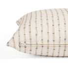 Side zipper detail of Tonic Living Hadley Stripe 20x20 throw pillow featuring blue and warm brown stripes on off-white.