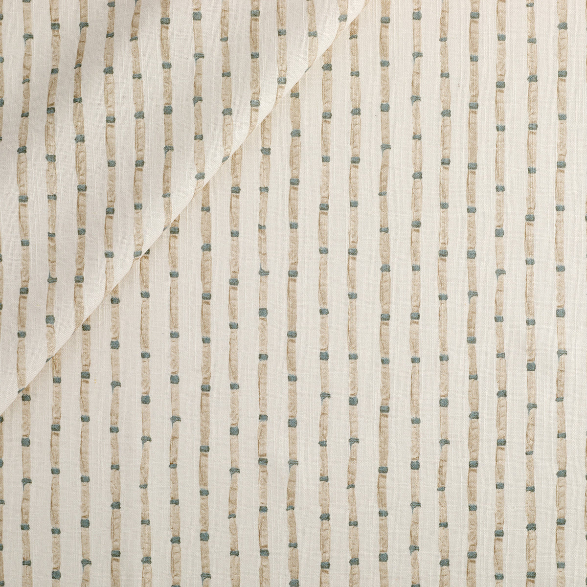 Tonic Living Hadley Stripe Fabric, an off-white, light brown, and blue drapery fabric with a bamboo-inspired stripe.