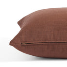 Side zipper detail of Tonic Living Hampton 22x22 pillow in earthy burgundy with a linen-inspired texture.