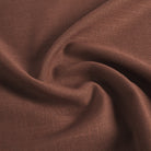 Tonic Living Hampton Burgundy performance upholstery fabric featuring a linen-inspired texture and deep burgundy colour with brown undertones.