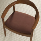 Tonic Living Hampton Burgundy high-performance upholstery fabric shown on a dining chair seat in a rich earthy burgundy.