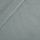 Tonic Living Hampton Fabric in Chambray, a dusty blue high-performance upholstery fabric with a Belgian linen look.