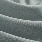 Close up of Tonic Living Hampton Chambray fabric showing textured blue weave with a linen-inspired finish.