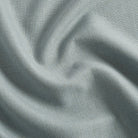 Tonic Living Hampton Chambray performance fabric with a soft dusty blue woven texture inspired by Belgian linen.