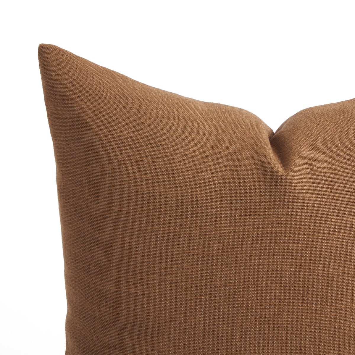 Close up of Tonic Living Hampton Cinnamon pillow showing its warm russet brown colour and linen-inspired woven texture.