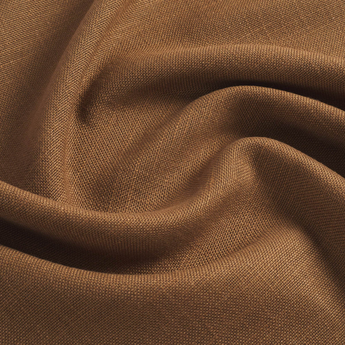 Tonic Living Hampton Cinnamon performance upholstery fabric featuring a linen-inspired texture and rich cinnamon brown colour.