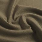 Tonic Living Hampton Moss performance upholstery fabric featuring a linen-inspired texture and earthy green colour.