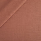 Tonic Living Hampton Fabric in Rosewood, an earthy rose high-performance upholstery fabric with the look of Belgian linen.