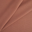 Tonic Living Hampton Fabric in Rosewood, a durable rose terracotta upholstery fabric with a soft woven texture and Belgian linen look.