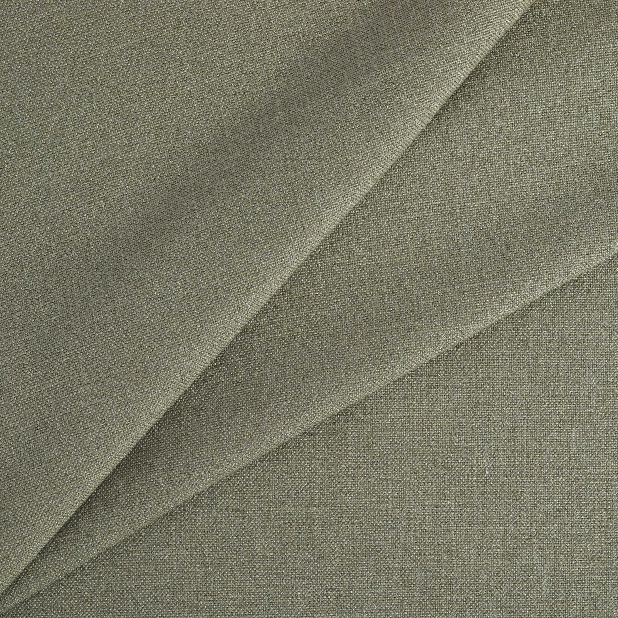 Tonic Living Hampton Sage upholstery fabric featuring a muted green tone with Belgian linen look and feel.