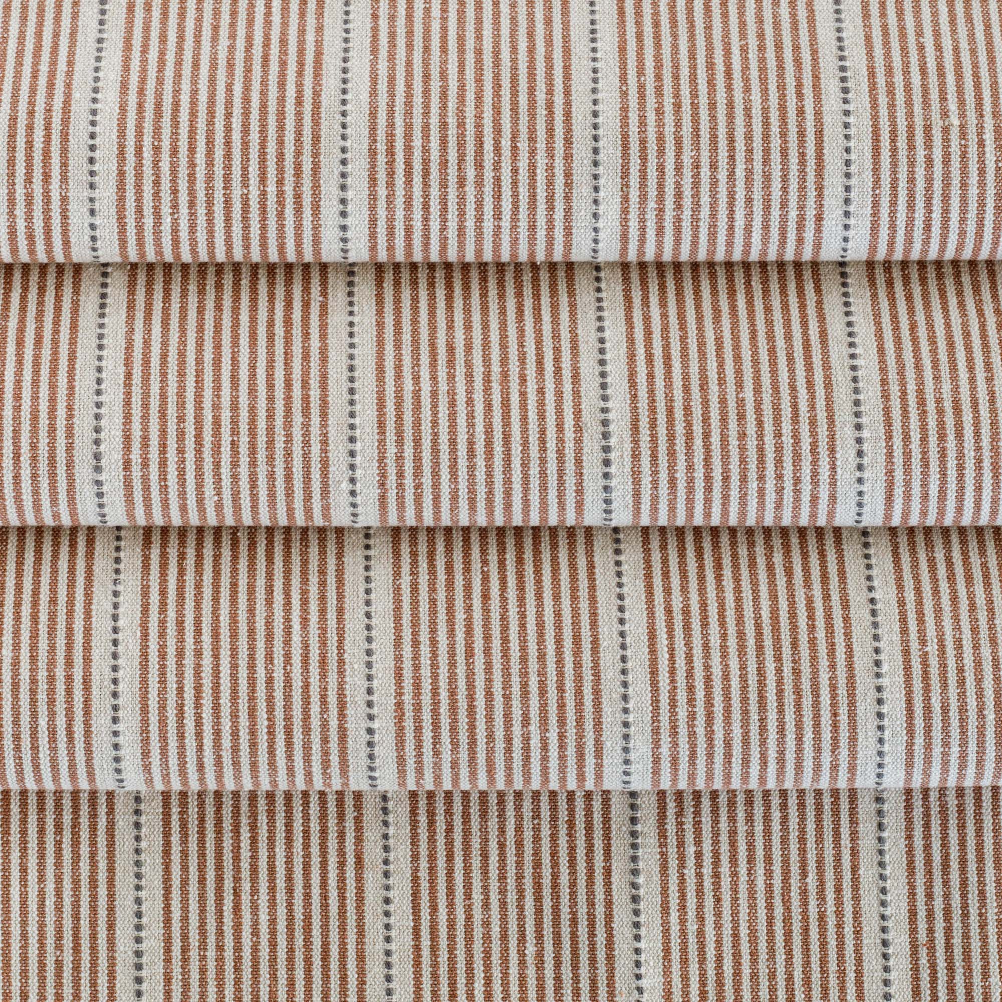 a rust red, parchment and black stripe multi use fabric