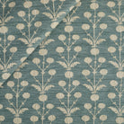 Tonic Living Hazel Fabric in Pool, a muted teal blue and oatmeal botanical upholstery fabric with a delicate floral pattern.