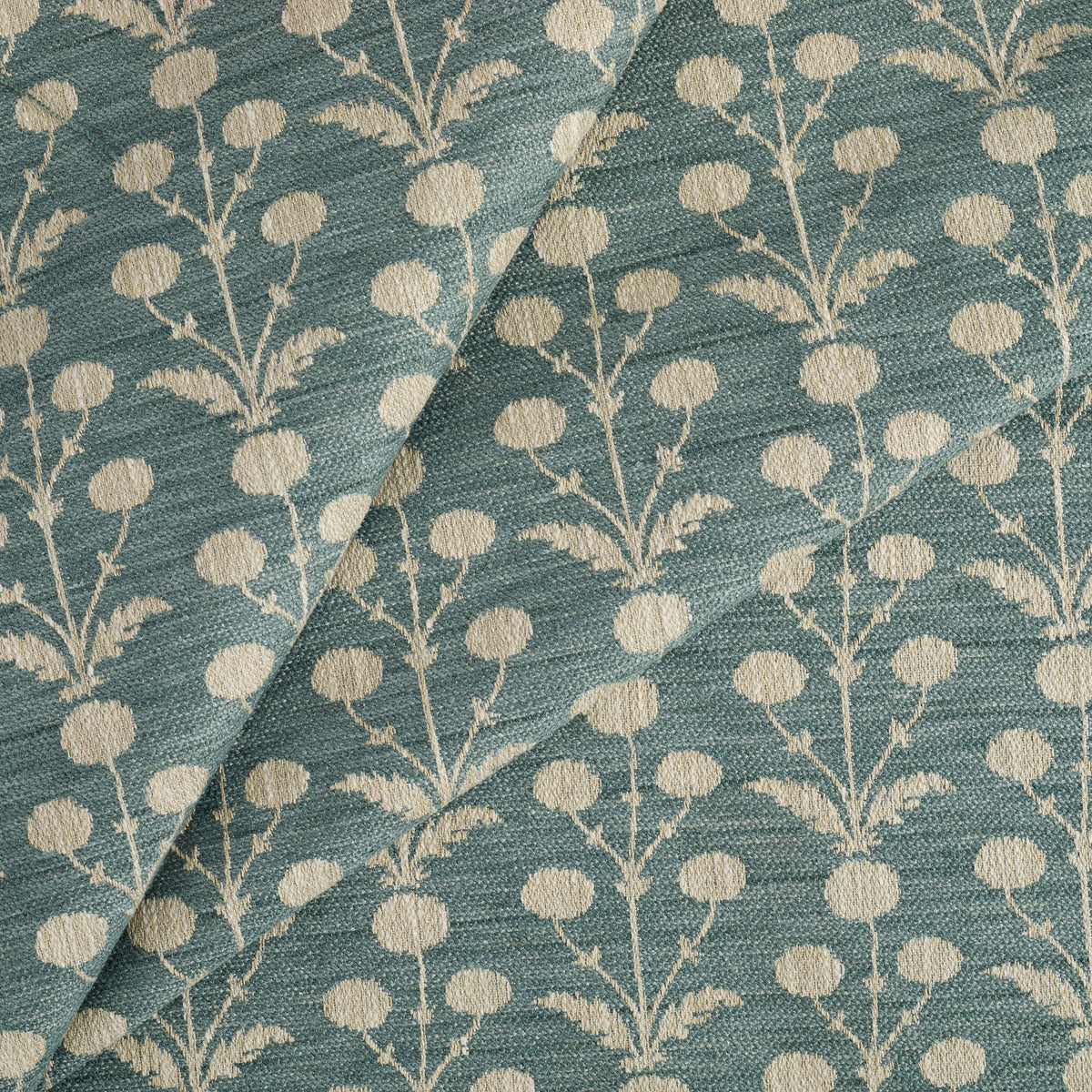 Tonic Living Hazel Pool floral upholstery fabric featuring a delicate botanical design in muted teal blue and oatmeal.