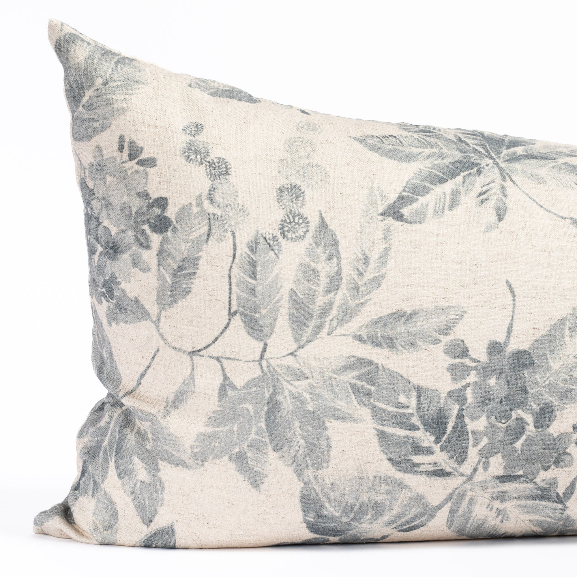 an indigo blue and oatmeal vintage floral print lumbar pillow