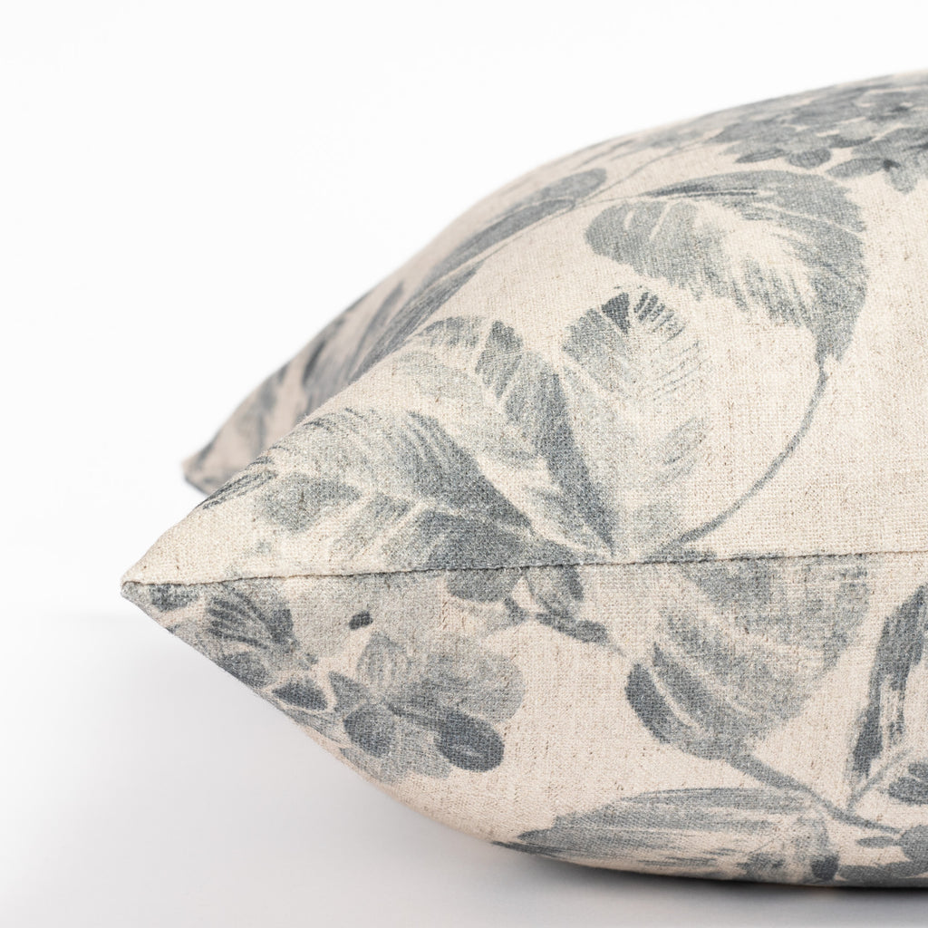 an indigo blue and oatmeal vintage floral print pillow : close up side view