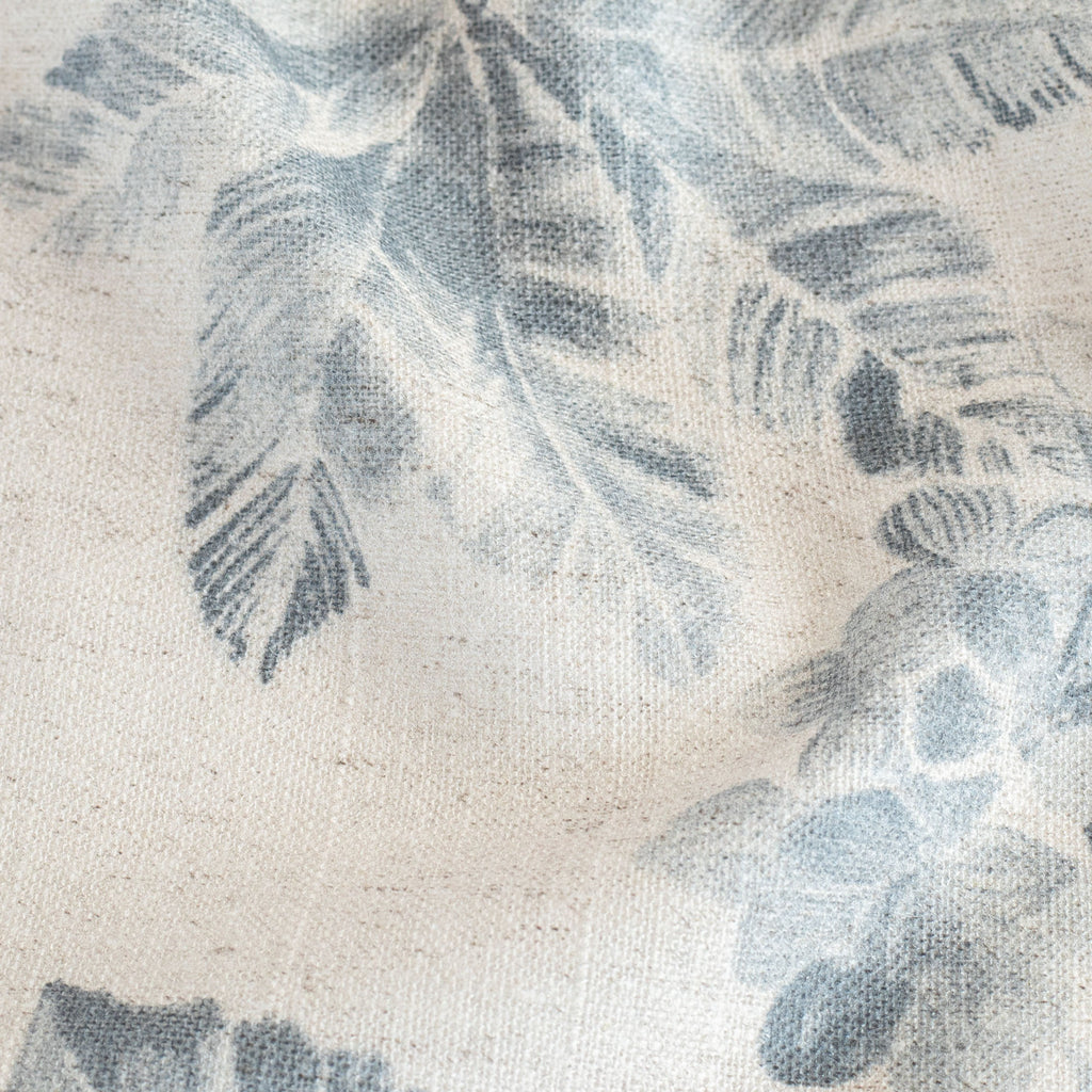 a cream and indigo blue floral pattern print fabric : detail view