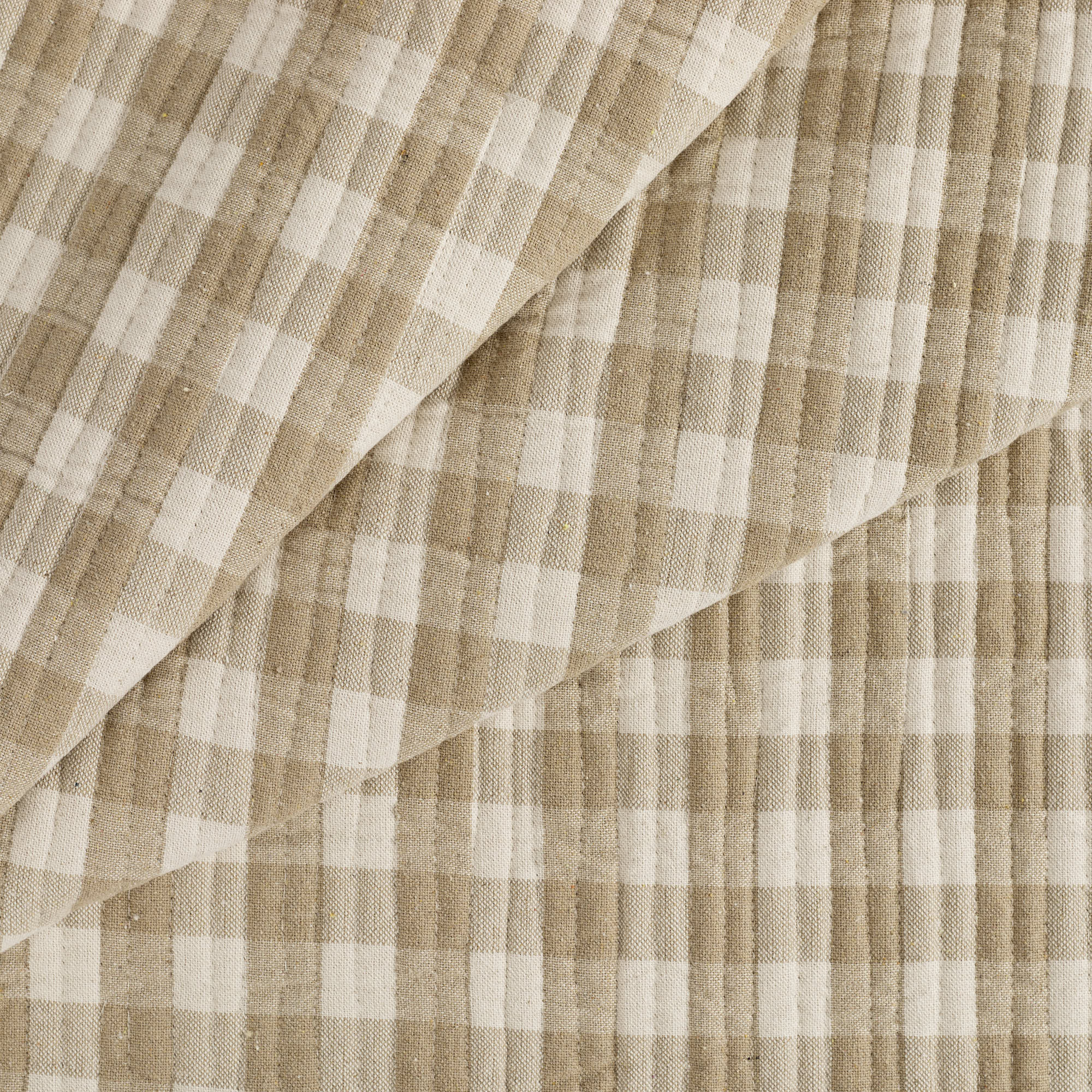 Tonic Living Henry Check Wheat matelassé fabric with a timeless off-white and beige check pattern.