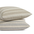 Tonic Living Hopper Stripe pillow collection in Toffee and Denim featuring layered stripe pillows in brown, tan and blue tones.