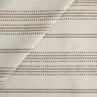 Tonic Living Hopper Stripe Fabric in Toffee, a neutral high-performance upholstery fabric with light brown stripes on an oatmeal background.