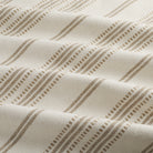 Tonic Living Hopper Stripe Toffee home decor fabric with a tailored stripe and woven band detailing in neutral tones.