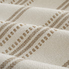Close up of Tonic Living Hopper Stripe Toffee fabric showing textured stripes with woven bands and dotted stitch detail.