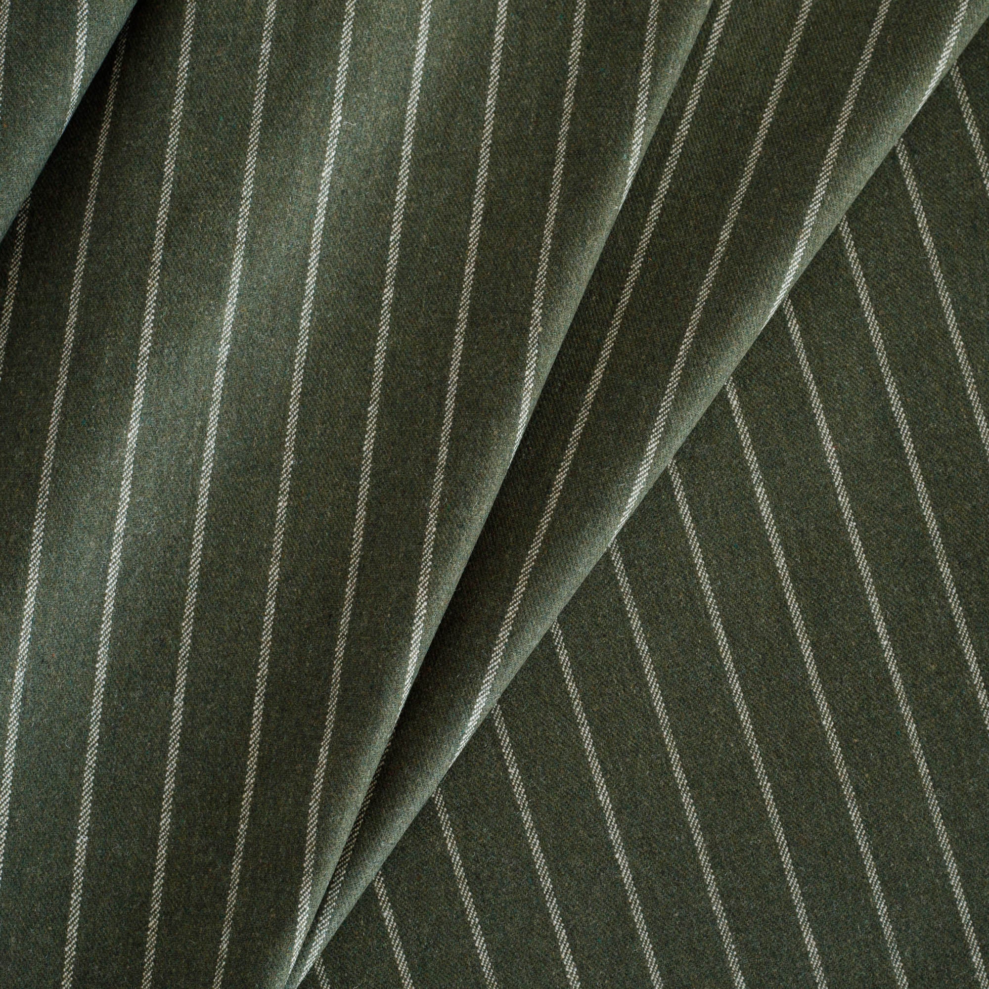 Hunter Stripe Moss Fabric, a deep green and cream classic pinstripe home decor fabric from Tonic Living