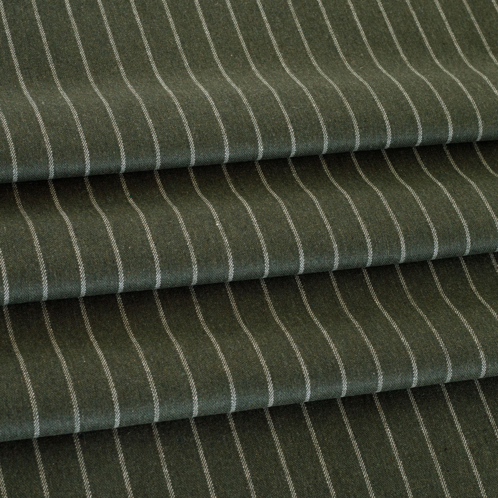 a deep green and cream vertical pinstripe patterned,  multi use home decor fabric