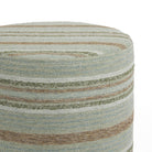 Close up of Tonic Living Indie Stripe round stool showing green, teal, brown, and white woven stripe detail.
